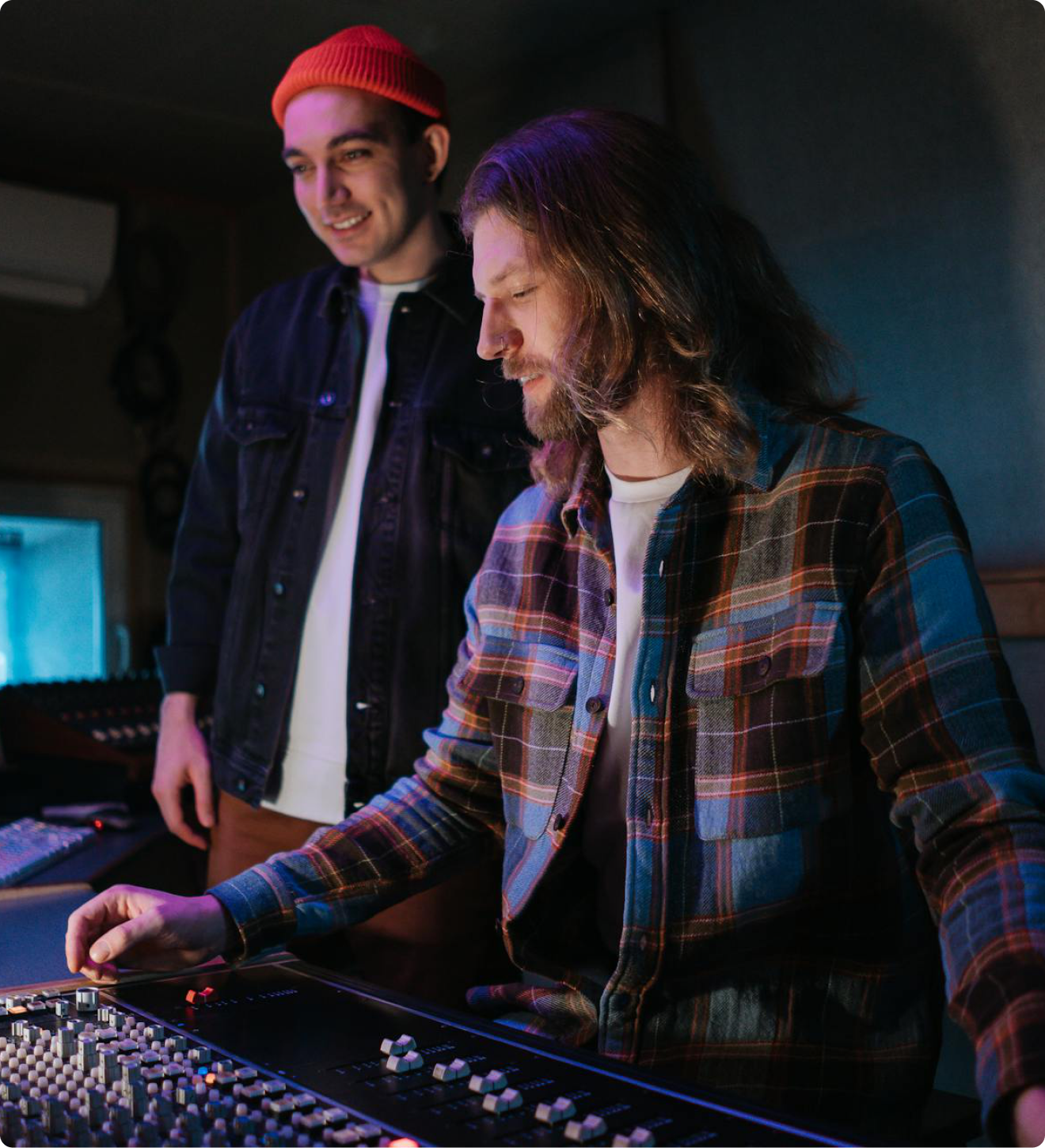 Two producers working in a studio